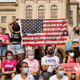 ATLANTA, GA - OCTOBER 02: Demonstrators hold signs as they rally in support of women's reproductive rights at the Georgia State Capitol on October 2, 2021 in Atlanta, Georgia. The Women's March and other groups organized marches across the country to protest the new abortion law in Texas. (Photo by Megan Varner/Getty Images)